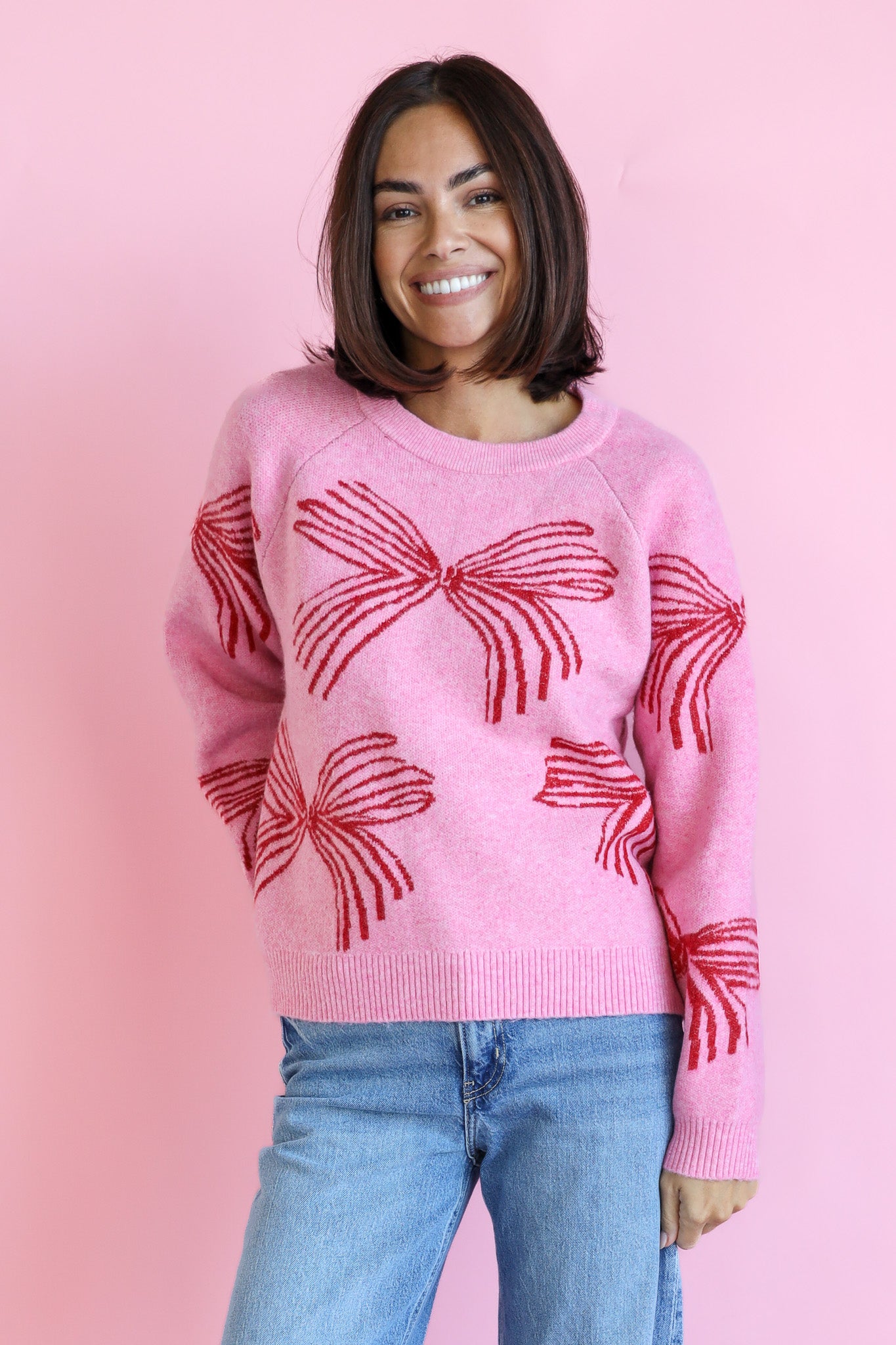 RED BOW SWEATER IN PINK